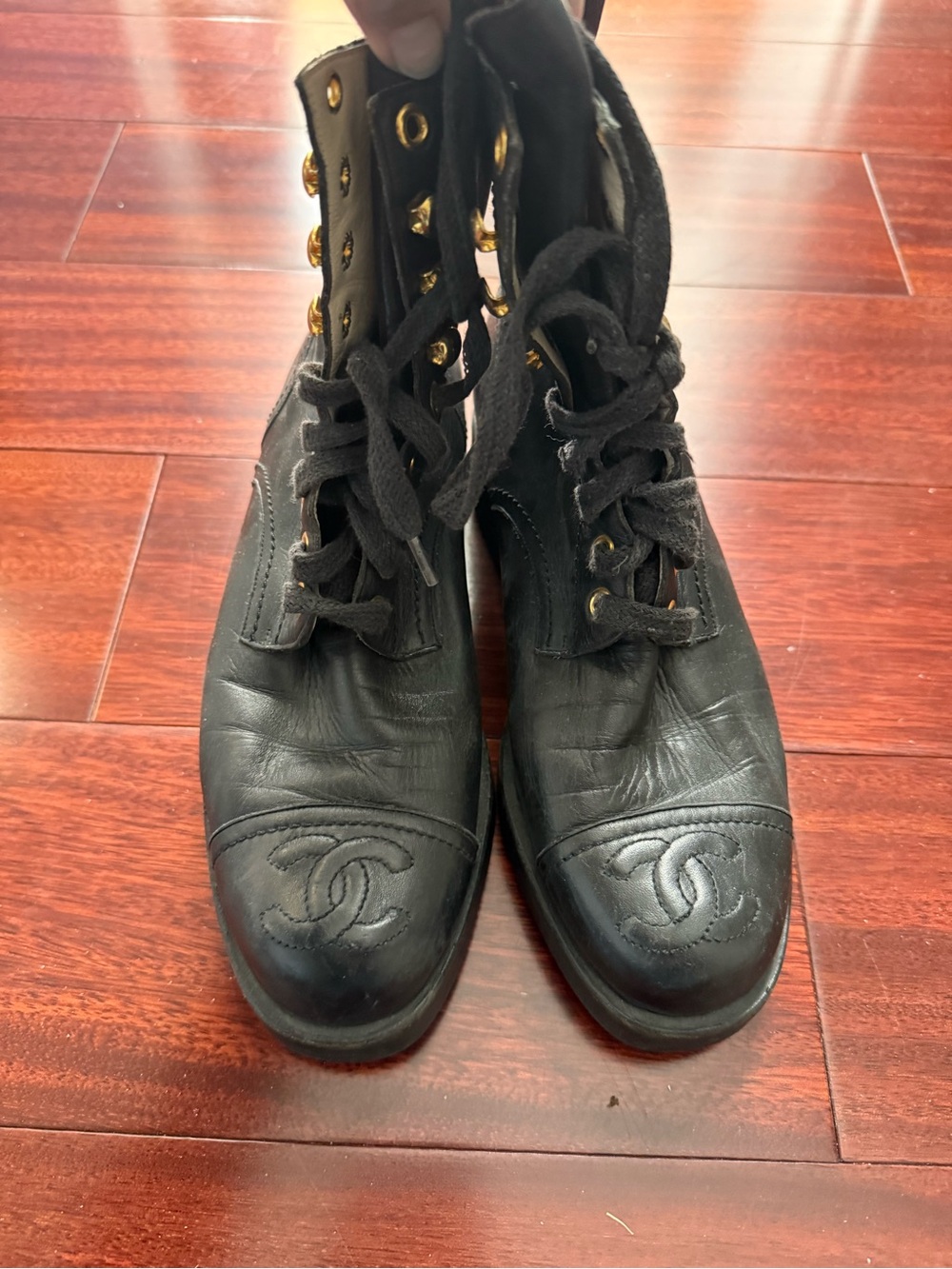 CHANEL Black Leather Lace-Up Logo Combat Boots with Gold Eyelets